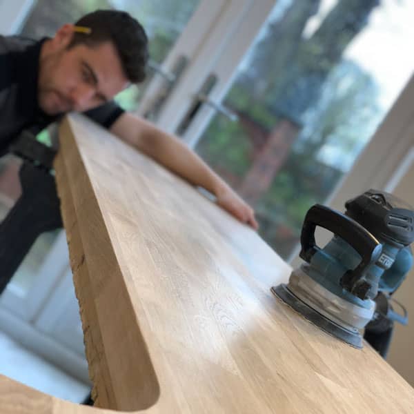 Joiner creating kitchen worktop